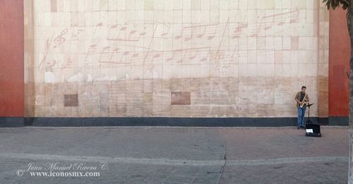 Full length of man standing against wall