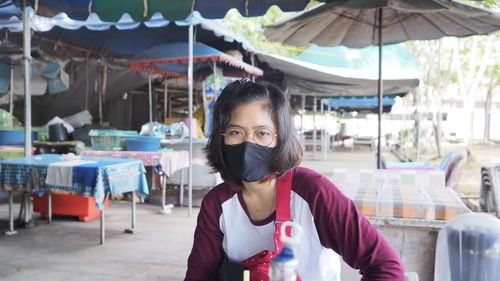 Portrait of woman standing outdoors