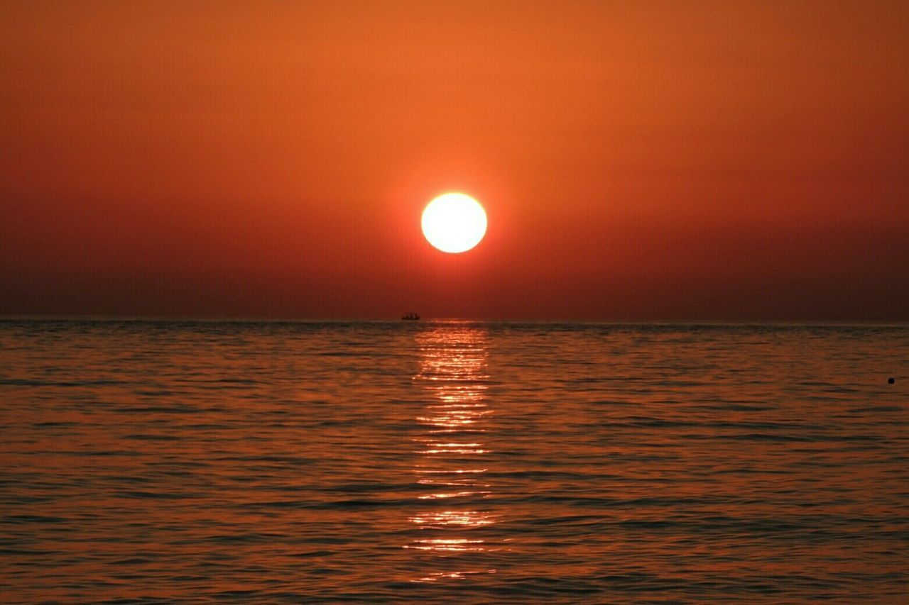 SCENIC VIEW OF SEA AT SUNSET