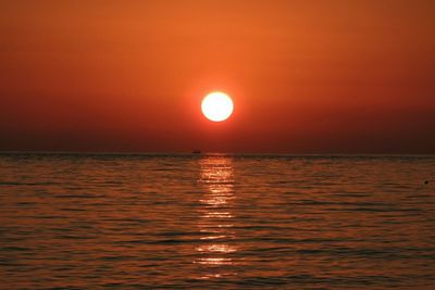 Scenic view of sea against sky at sunset