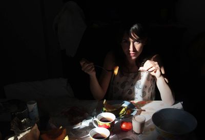 Portrait of woman having breakfast at home