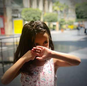 Portrait of girl standing outdoors