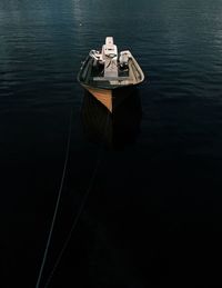 A single boat on dark water