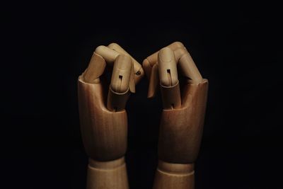 High angle view of shoes on wood against black background