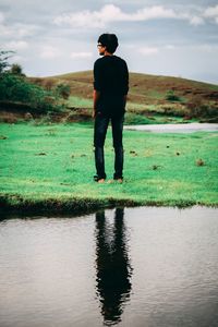 Reflection of man in lake