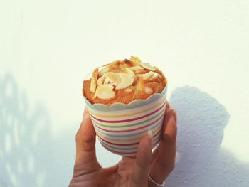 Midsection of person holding ice cream