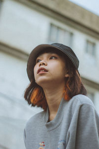 Portrait of young woman looking away