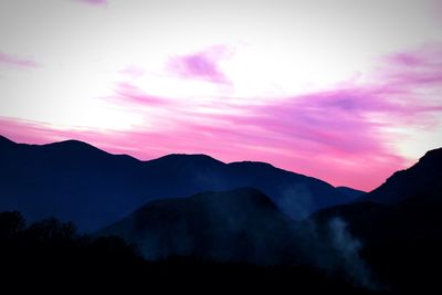 Scenic view of mountains against dramatic sky