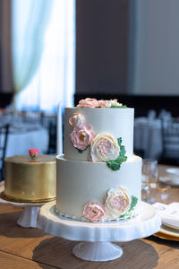 2 tier wedding cake with edible flowers.