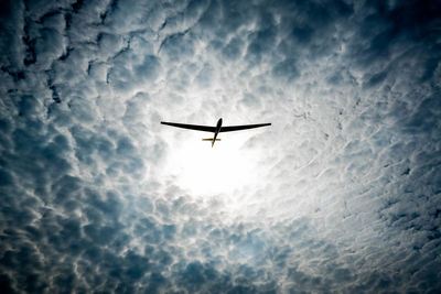 Low angle view of airplane flying in sky