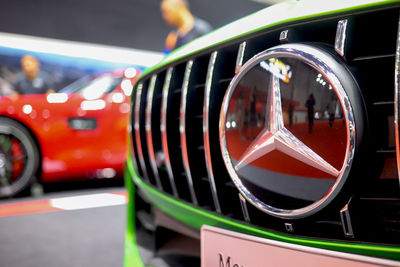 Close-up of red vintage car on road