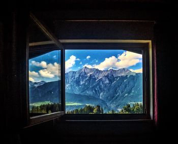 Scenic view of mountains seen through window