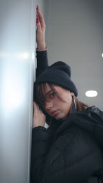 Portrait of young woman in hat