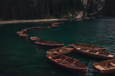 Boats moored in lake