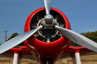 Close-up of propeller airplane against sky