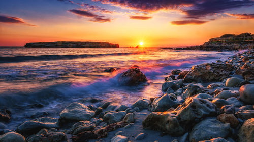 Scenic view of sea against sky during sunset