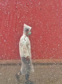 Reflection of person standing in water during winter