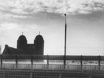Low angle view of building against cloudy sky