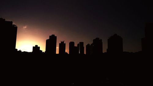 Silhouette of skyscrapers at sunset