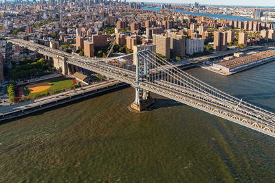 High angle view of bridge over river against buildings