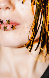 Midsection of woman with flowers