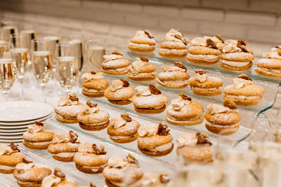 Cakes and champagne on a festive banquet table