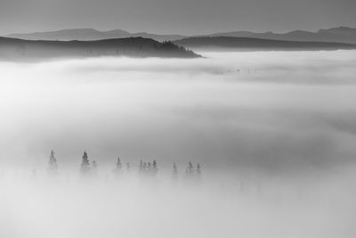 Scenic view of mountains in foggy weather