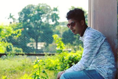Side view of young man looking away