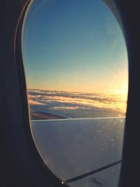 View of airplane wing seen through window