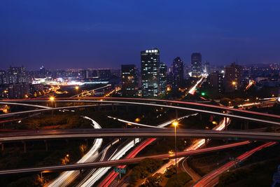 High angle view of illuminated cityscape at night