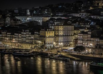 Sailboats in city at night