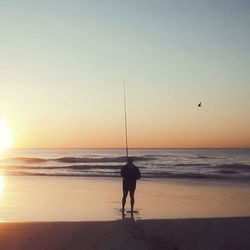 Scenic view of sea at sunset