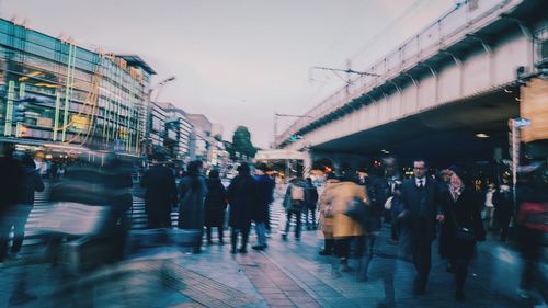 People walking on street in city