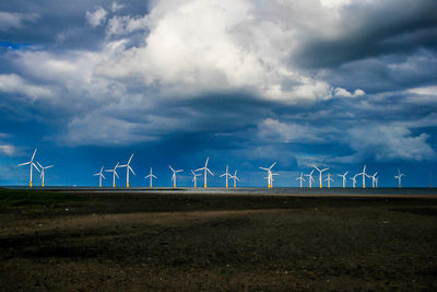 Wind turbines in field