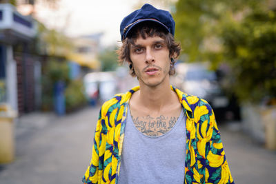 Portrait of man standing on street