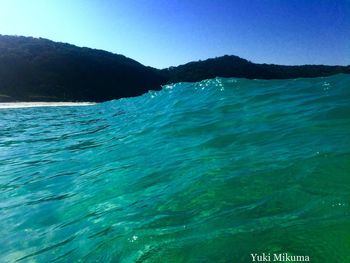Scenic view of sea against clear blue sky