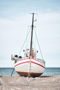 Boat in sea against sky