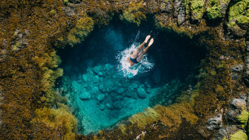 High angle view of man swimming in sea