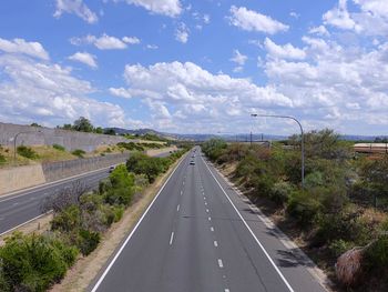 Empty road against sky