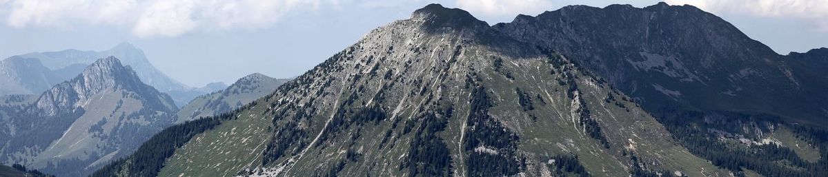 Panoramic view of snowcapped mountains against sky