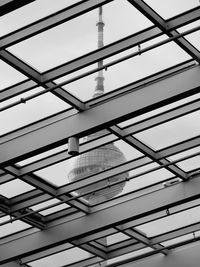 Low angle view of modern building ceiling against clear sky