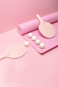High angle view of pills on pink background