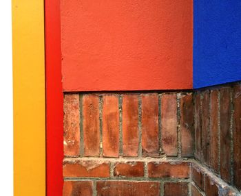 Multi colored paint on brick wall