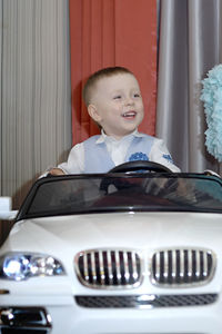 Boy smiling in car