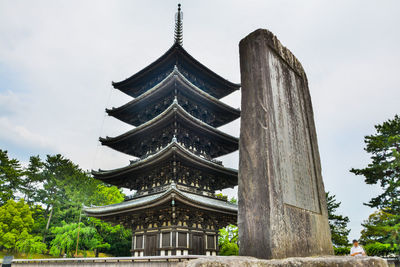 Low angle view of pagoda against sky