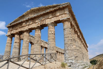 Low angle view of old ruin building against sky