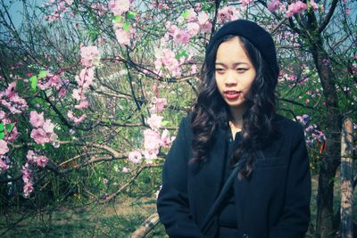 Portrait of young woman in park