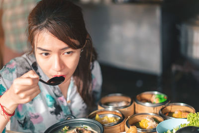 Portrait of woman holding ice cream