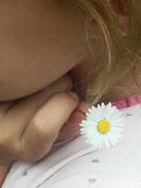 Close-up of woman holding flowers