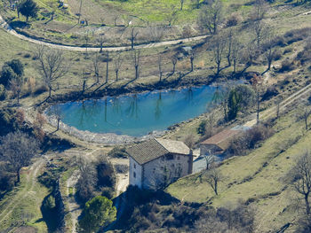 High angle view of lake by buildings